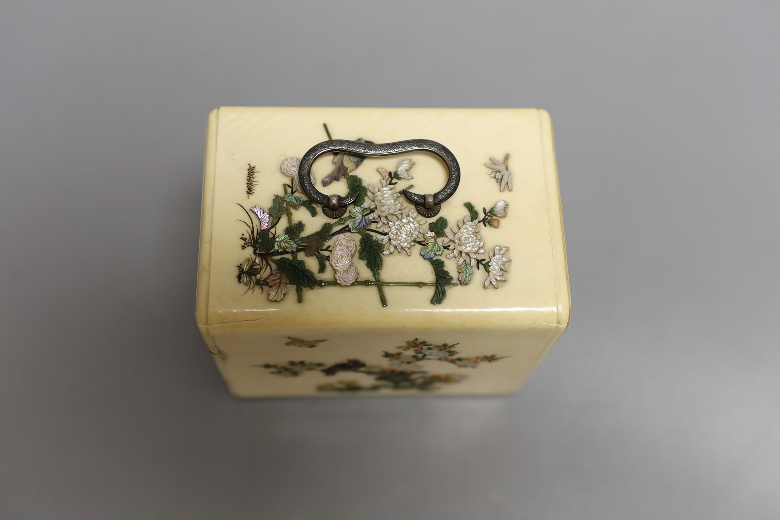 A Japanese Shibayama style ivory kodansu (table cabinet), Meiji period, with white metal lock, hinges and handles, 7cms high x 10 cms deep.